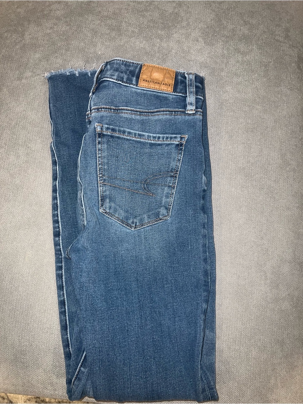 American Eagle Light Blue Denim Jeans with Tan Stitching